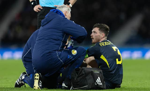 Scotland's Andy Robertson goes down injured against Northern Ireland.
