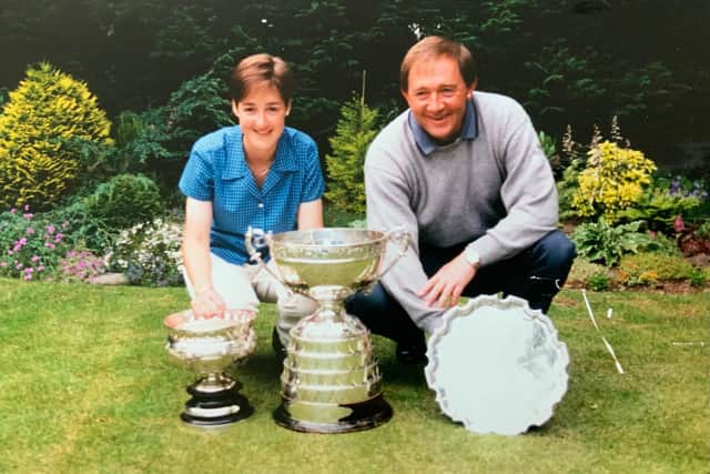Alison Davidson shows off her trophy haul in 1997 alongside her coach, John Chillas.