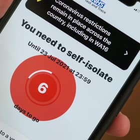 A smartphone using the NHS Covid-19 app alerts the user "You need to self-isolate. Picture: Christopher Furlong/Getty Images