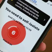 A smartphone using the NHS Covid-19 app alerts the user "You need to self-isolate. Picture: Christopher Furlong/Getty Images