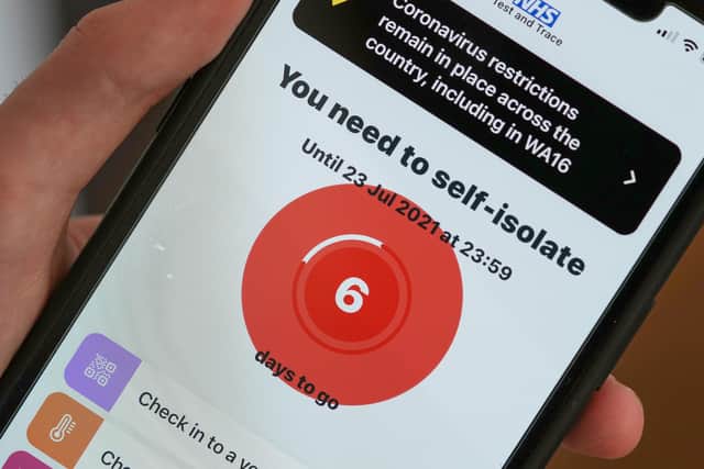 A smartphone using the NHS Covid-19 app alerts the user "You need to self-isolate. Picture: Christopher Furlong/Getty Images