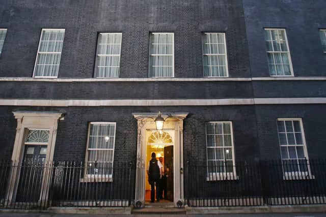 The exterior of 10 Downing Street, where it is reported staff left from the 'back door', according to a recent report (Photo: Daniel Leal-Olivas, PA).