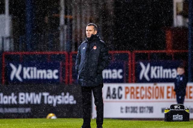 Aberdeen manager Stephen Glass in the rain during Saturday's 2-1 defeat to Dundee at Dens Park. He has been given stiff backing by chairman Dave Cormack