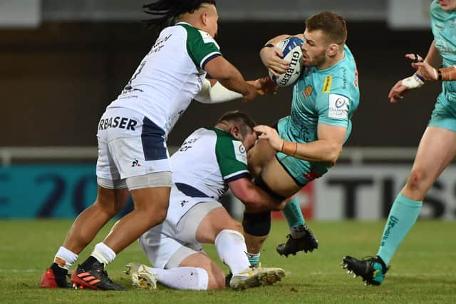 Exeter Chiefs' English hooker Luke Cowan-Dickie (R) is tackled by Montpellier's French prop Enzo Forletta.