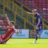 Marc McNulty scored twice for Dundee United against Aberdeen.