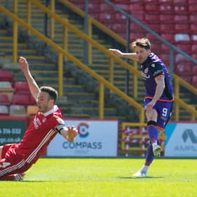 Marc McNulty scored twice for Dundee United against Aberdeen.