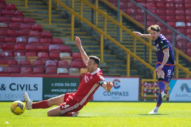 Marc McNulty scored twice for Dundee United against Aberdeen.