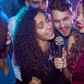 Here's how to try out Spotify Karaoke for yourself. Photo: mediaphotos / Getty Images / Canva Pro.