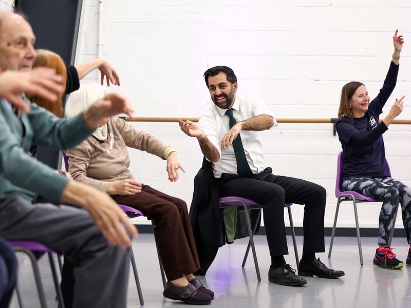 Humza Yousaf takes part in a dance performance during a visit to the Edinburgh Community Performing Arts re-connect project