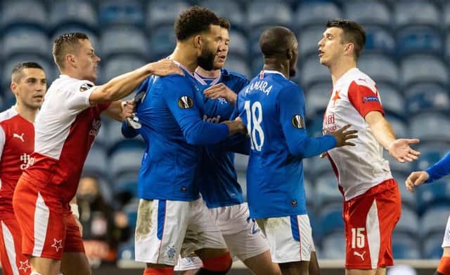 Ondrej Kudela (right) is confronted by Glen Kamara and Connor Goldson at Ibrox on March 18. The Slavia Prague defender has now been banned for 10 games by UEFA for racist abuse of Rangers midfielder Kamara. (Photo by Alan Harvey / SNS Group)