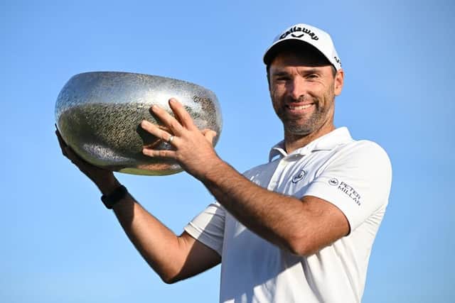 Oliver Wilson poses with the trophy after winning the Made in HimmerLand in Denmark. Picture: Stuart Franklin/Getty Images.
