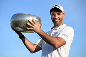 Oliver Wilson poses with the trophy after winning the Made in HimmerLand in Denmark. Picture: Stuart Franklin/Getty Images.