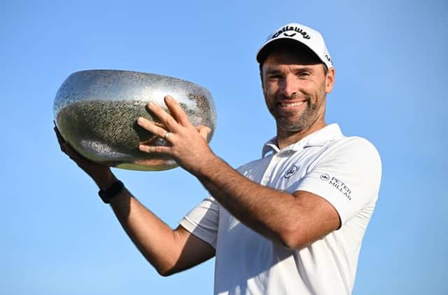 Oliver Wilson poses with the trophy after winning the Made in HimmerLand in Denmark. Picture: Stuart Franklin/Getty Images.