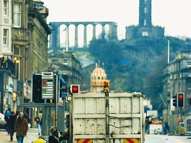 Cleansing department road cleaners clearing up Princes Street after the 1995 Hogmanay celebrations.