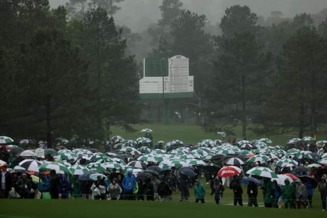 Patrons evacuate the grounds after play was suspended for the day due to weather conditions during the third round of the 2023 Masters at Augusta National. Picture: Patrick Smith/Getty Images.