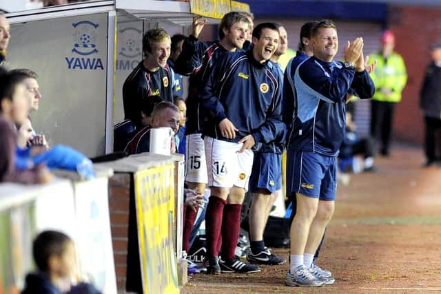 Kevin McGoldrick and Martyn Corrigan watch their side defeat Kilmarnock 2-1 in the League Cup. (Picture: John Devlin)