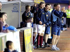 Kevin McGoldrick and Martyn Corrigan watch their side defeat Kilmarnock 2-1 in the League Cup. (Picture: John Devlin)