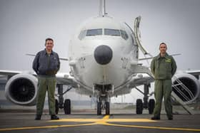 Group Captain Chris Layden and Wing Commander James Hanson, in front of a submarine-hunting Poseidon MRA1 plane at RAF Lossiemouth (Picture: Jane Barlow/PA)