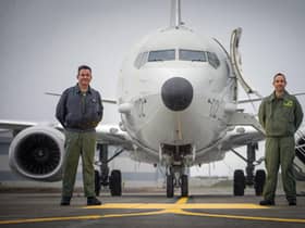 Group Captain Chris Layden and Wing Commander James Hanson, in front of a submarine-hunting Poseidon MRA1 plane at RAF Lossiemouth (Picture: Jane Barlow/PA)