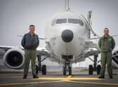 Group Captain Chris Layden and Wing Commander James Hanson, in front of a submarine-hunting Poseidon MRA1 plane at RAF Lossiemouth (Picture: Jane Barlow/PA)