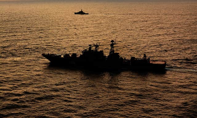 The Udaloy-class destroyer Vice-Admiral Kulakov, one of the four Russian ships that the HMS Tyne (top) kept watch over as they sheltered from rough weather in the seas off the east coast of Scotland (photo: PA).