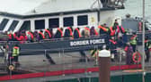 A group of people thought to be migrants are brought in to Dover, Kent, following a small boat incident in the Channel at the weekend.  Pic: PA Wire