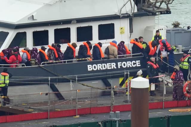 A group of people thought to be migrants are brought in to Dover, Kent, from a Border Force vessel following a small boat incident in the Channel. Picture: Gareth Fuller/PA
