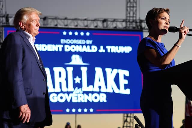 Former US President Donald Trump looks on as the Republican nominee for governor of Arizona, Kari Lake, speaks at a campaign rally in Mesa (Picture: Mario Tama/Getty Images)