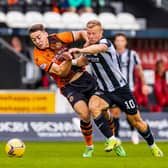 Curtis Main challenges Louis Appere during St Mirren v Dundee United.