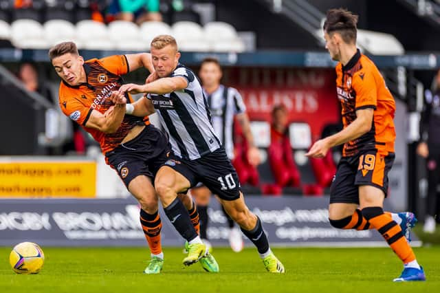 Curtis Main challenges Louis Appere during St Mirren v Dundee United.