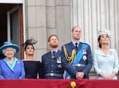 (Left to right) Queen Elizabeth II, the Duchess of Sussex, Duke of Sussex, and the Duke and Duchess of Cambridge (now the Prince and Princess of Wales) watching the RAF 100th anniversary flypast from the balcony of Buckingham Palace. Picture: Paul Grover/Daily Telegraph/PA Wire