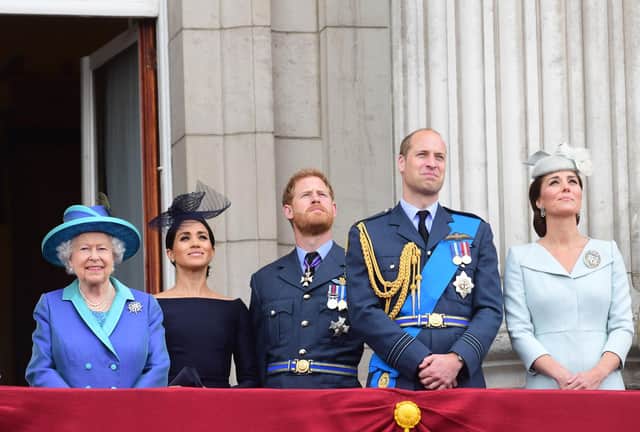 (Left to right) Queen Elizabeth II, the Duchess of Sussex, Duke of Sussex, and the Duke and Duchess of Cambridge (now the Prince and Princess of Wales) watching the RAF 100th anniversary flypast from the balcony of Buckingham Palace. Picture: Paul Grover/Daily Telegraph/PA Wire