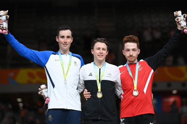 LONDON, ENGLAND - JULY 31: (L - R) Silver Medalist, John Archibald of Team Scotland, Gold Medalist, Corbin Strong of Team New Zealand and William Roberts of Team Wales celebrate on the podium during the Men's Track Cycling 15km Scratch Race medal ceremony on day three of the Birmingham 2022 Commonwealth Games at Lee Valley Velopark Velodrome on July 31, 2022 on the London, England. (Photo by Justin Setterfield/Getty Images)