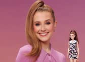 Rose Ayling-Ellis poses with the first ever Barbie doll with a behind-the-ear hearing aid