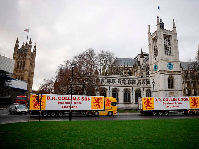 Lorries from Scottish seafood companies drive past the Houses of Parliament last month, in a protest action by fishermen against post-Brexit red tape.