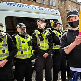 Protestors block an immigration enforcement van, stopping it from leaving Glasgow's Kenmure Street in Nicola Sturgeon's constituency in May 2021. Picture: Jeff J Mitchell/Getty Images