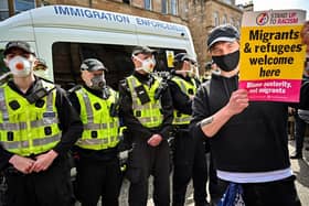 Protestors block an immigration enforcement van, stopping it from leaving Glasgow's Kenmure Street in Nicola Sturgeon's constituency in May 2021 (Picture: Jeff J Mitchell/Getty Images)