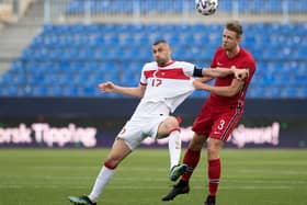 Turkey's forward Burak Yilmaz (L) heads the ball with Norway's defender Kristoffer Ajer during the FIFA World Cup Qatar 2022 qualification football match between Norway and Turkey at La Rosaleda stadium in Malaga on March 27, 2021. (Photo by JORGE GUERRERO/AFP via Getty Images)