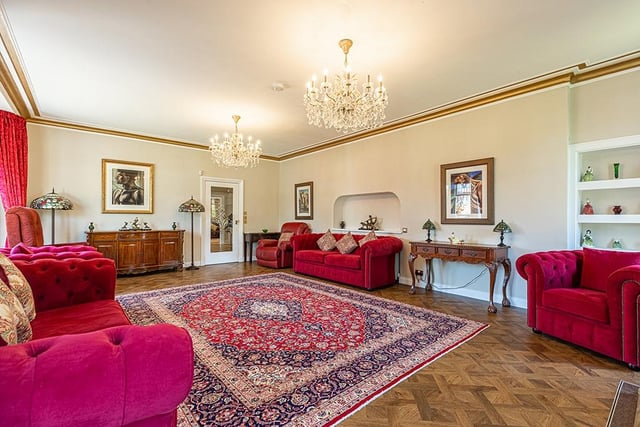 Interior: There is a large lounge, dining room, open-plan living/kitchen/dining space with balcony, rear family room and garage. The ensuite first bedroom is downstairs, while the rest are on the first floor.