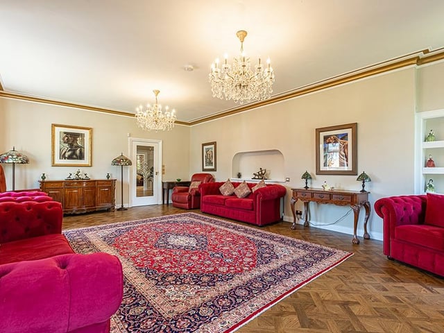 Interior: There is a large lounge, dining room, open-plan living/kitchen/dining space with balcony, rear family room and garage. The ensuite first bedroom is downstairs, while the rest are on the first floor.