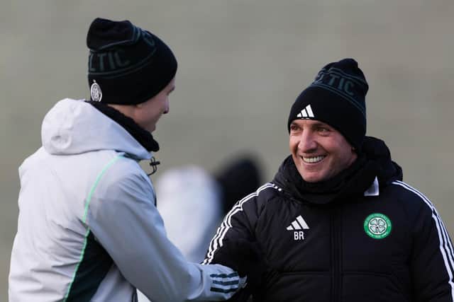 Brendan Rodgers shares a smile with David Turnbull during a Celtic training session.