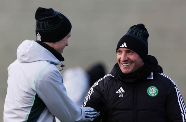 Brendan Rodgers shares a smile with David Turnbull during a Celtic training session.
