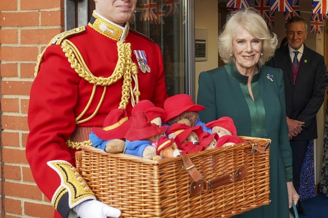 During the visit, Camilla gave the children Paddington bear toys which members of the public had left at the Long Walk in Windsor and outside Buckingham Palace following the Queen’s death in September.