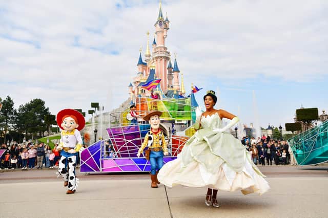 Jesse, Woody and Tiana leading the floats of the Dream... And Shine Brighter show at Disneyland Paris. Pic: PA Photo/Disney/Valentin Desjardins.