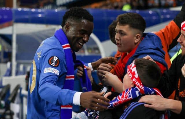 Rangers forward Fashion Sakala celebrates with supporters after the Europa League quarter-final victory over Braga at Ibrox. (Photo by Craig Williamson / SNS Group)