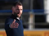 James McPake saw his Dundee side secure second spot in the Championship with a 2-0 win over Queen of the South