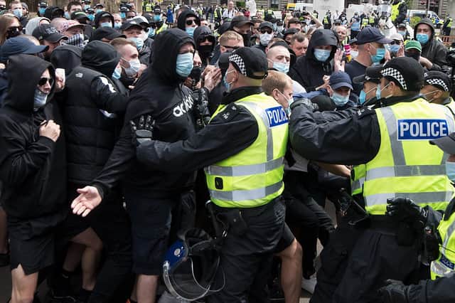 Police engage with protesters who have converged on George Square in Glasgow