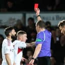 Aberdeen captain Graeme Shinnie is shown a red card for his challenge on Ross County's Jack Baldwin following a VAR check.  (Photo by Mark Scates / SNS Group)