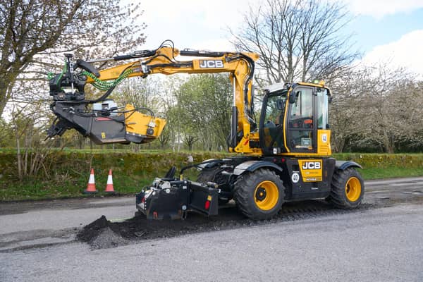 JCB's PotholePro machine in action in Alness today. Picture: JCB