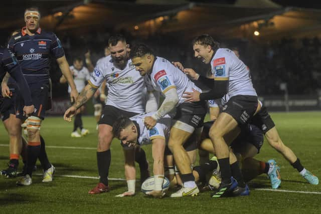 Glasgow Warriors' Jack Dempsey scores the first try of the match against Edinburgh at Scotstoun.